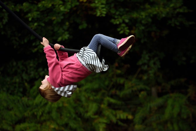 Child on the zipline at Strawberry Castle play area